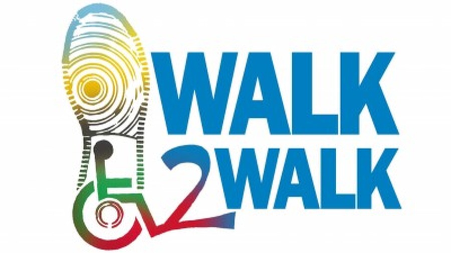Multicolor Walk2Walk logo with shoe print and wheelchair symbol