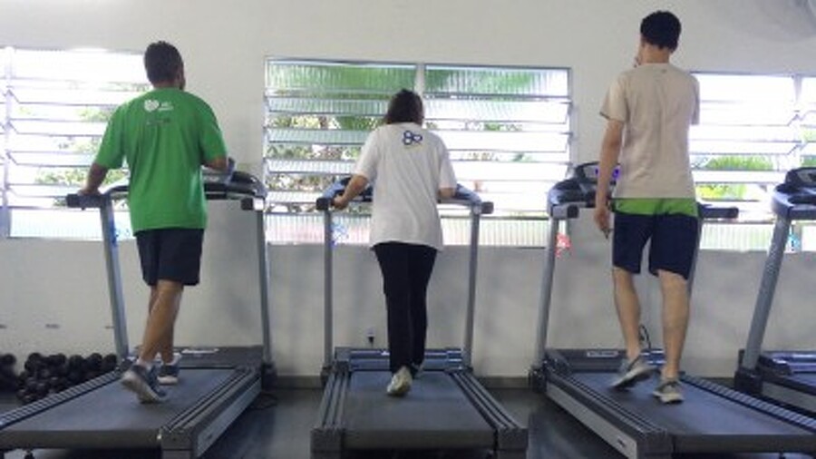 3 individuals walking on treadmills